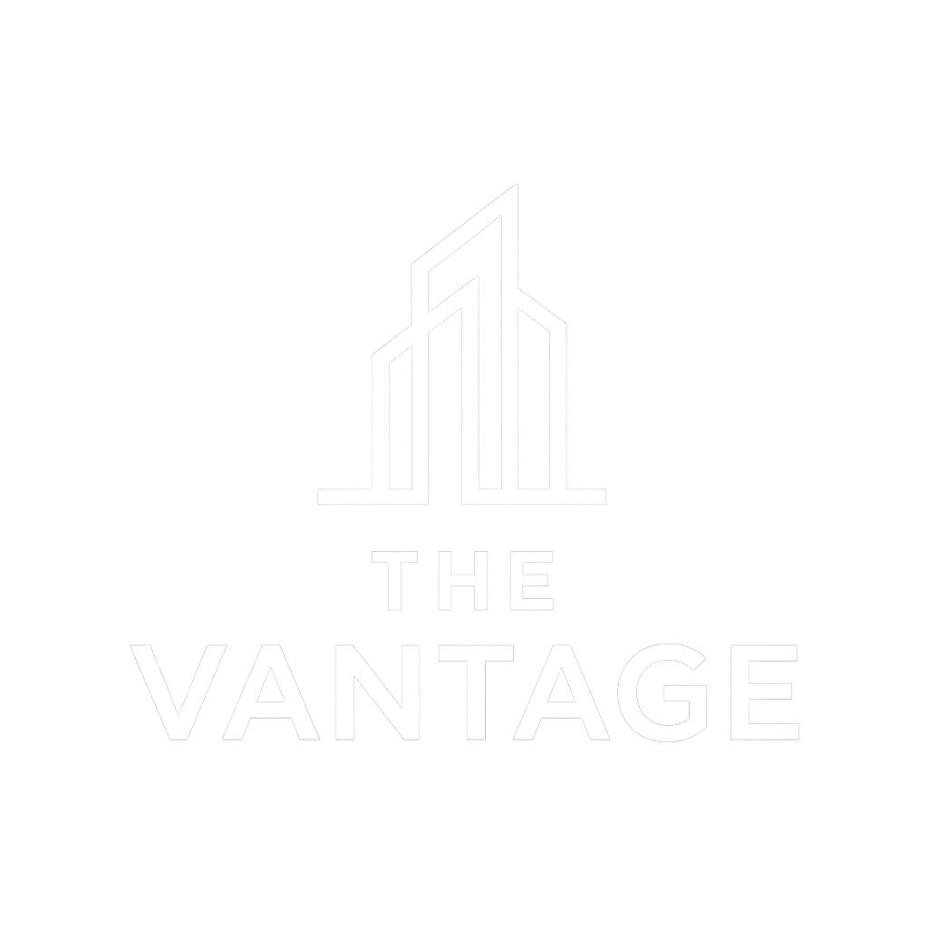 A neon sign that says "The Vantage" with a building graphic.